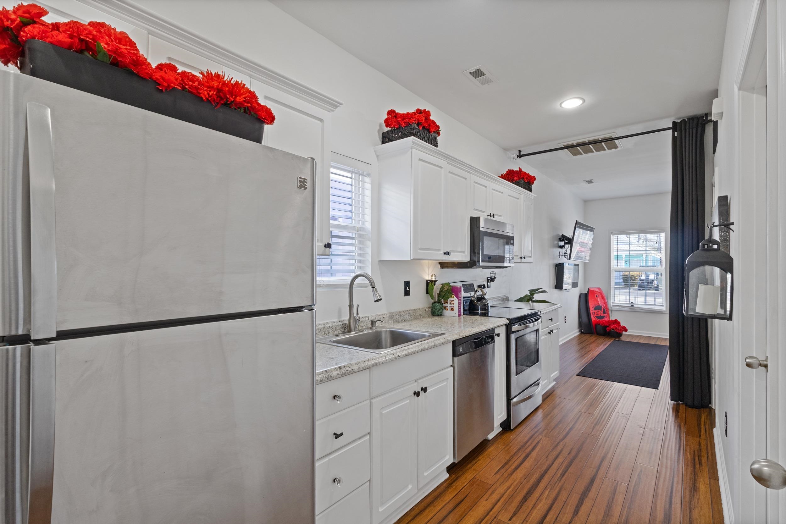 141 Addison Cottage Way Murrells Inlet, SC 29576 - Photo 7 of 17 Kitchen with appliances with stainless steel finishes, white cabinets, dark wood-style flooring, plenty of natural light, and recessed lighting