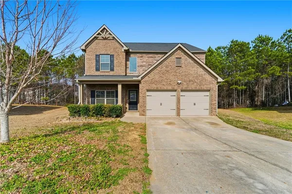 front view of a house with a yard
