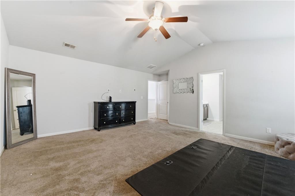 6771 Mason Lane Rex, GA 30273 - Photo 25 of 30 a view of empty room with a fireplace and a ceiling fan