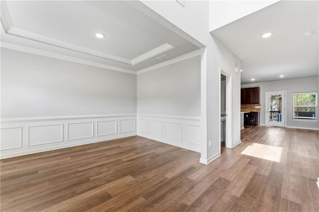 6771 Mason Lane Rex, GA 30273 - Photo 3 of 30 a view of an empty room with window and wooden floor