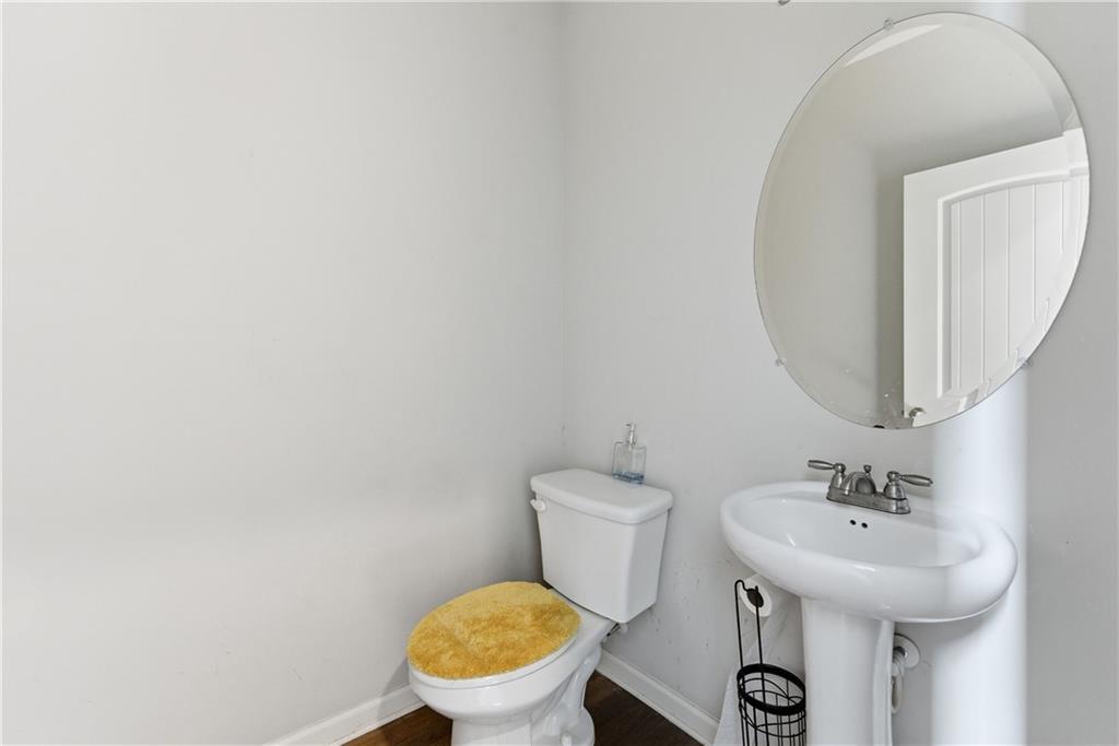 6771 Mason Lane Rex, GA 30273 - Photo 6 of 30 a bathroom with a sink and a toilet