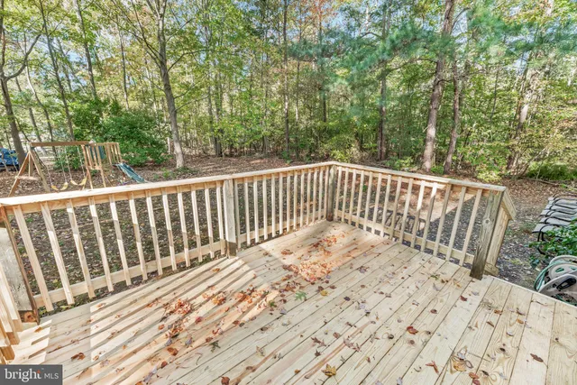 a view of balcony with wooden floor