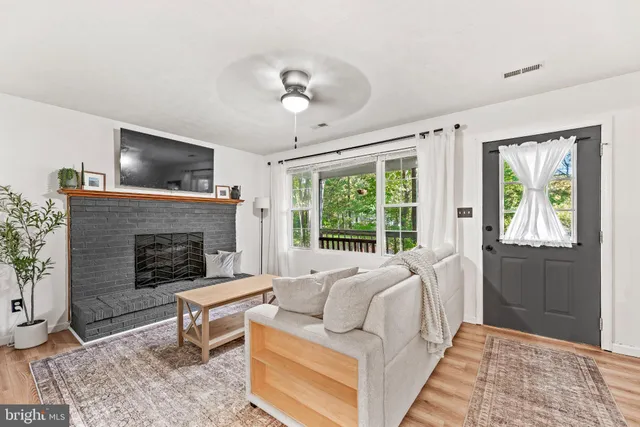 a bedroom with a bed and a fireplace