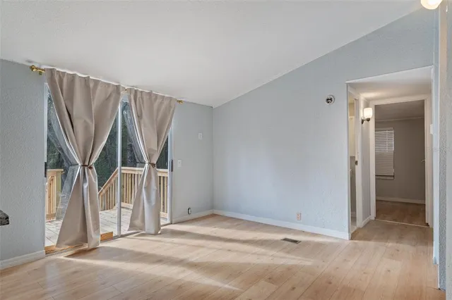 a view of an empty room with a window