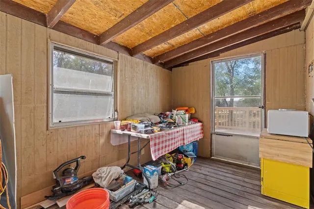 a bedroom with furniture and a window