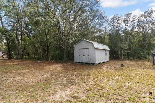 a house with trees in the background