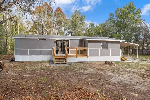 a house with trees in the background