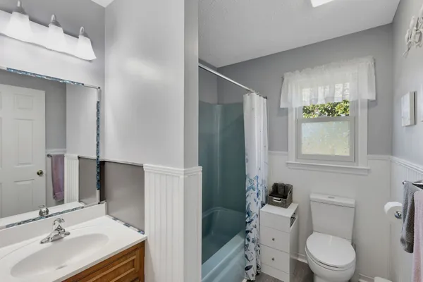 a bathroom with a sink and toilet