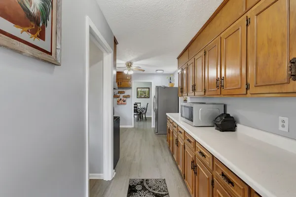 a kitchen with stainless steel appliances a refrigerator and cabinets