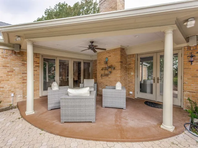 view of living room filled with furniture and large window