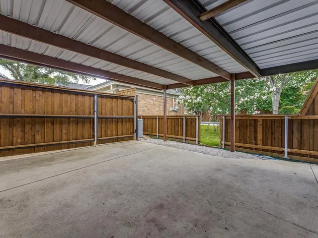 a view of backyard with wooden floor and roof