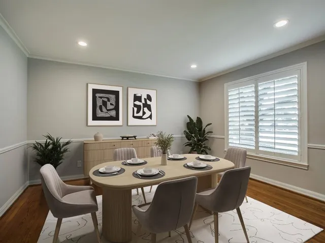 a dining room with furniture and window