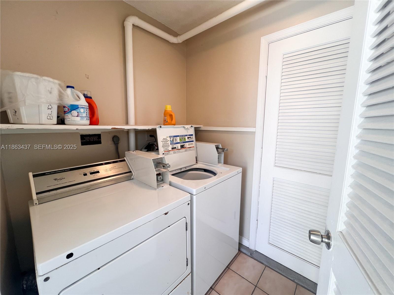 769 Jeffery Street, Unit 2205 Boca Raton, FL 33487 - Photo 22 of 30 a utility room with dryer and washer