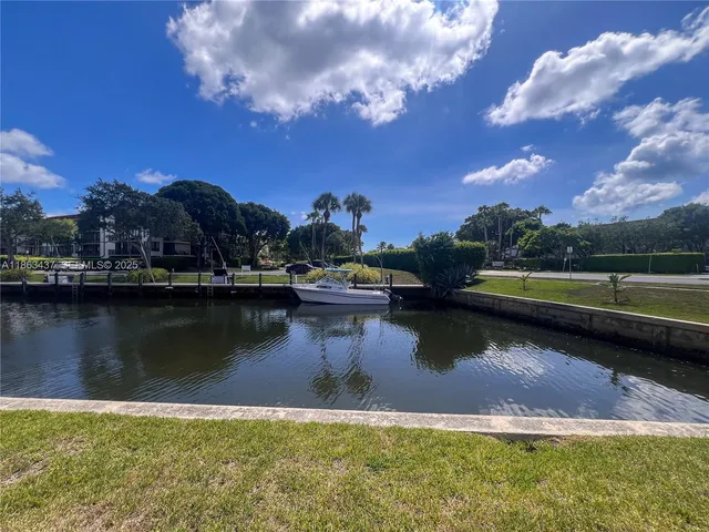 a view of a lake with a house in the background