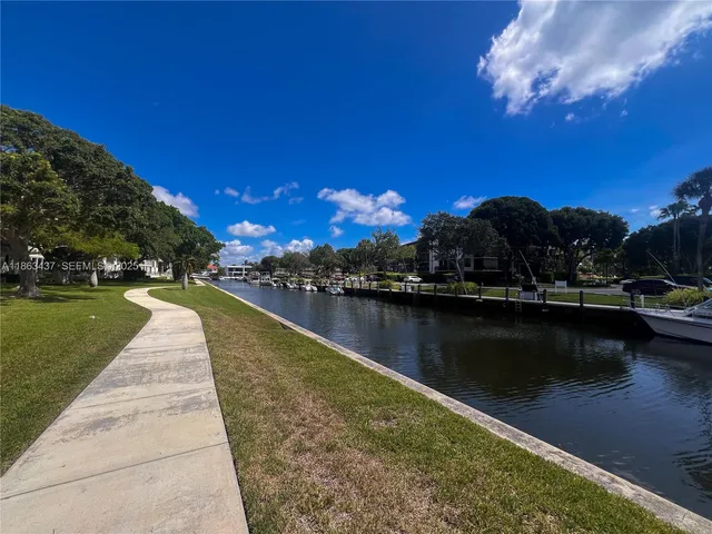 a view of a lake with a yard