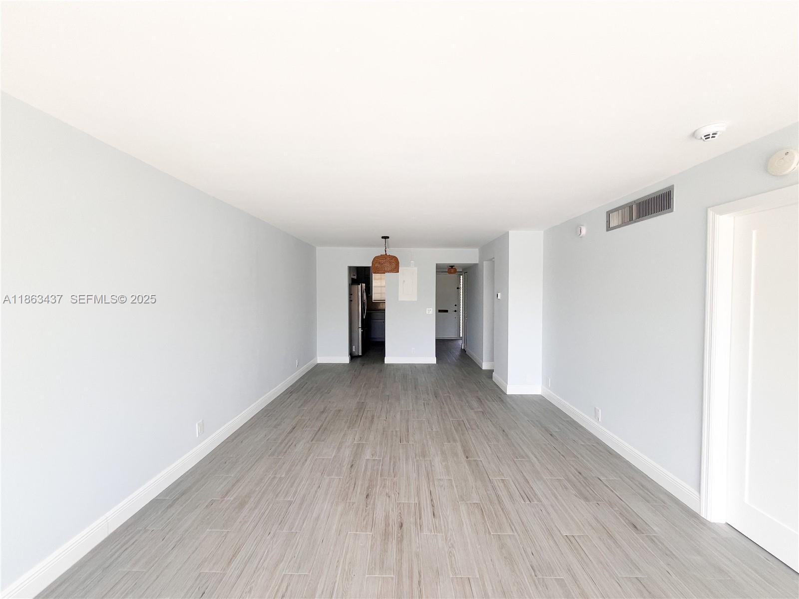 769 Jeffery Street, Unit 2205 Boca Raton, FL 33487 - Photo 5 of 30 a view of empty room with wooden floor