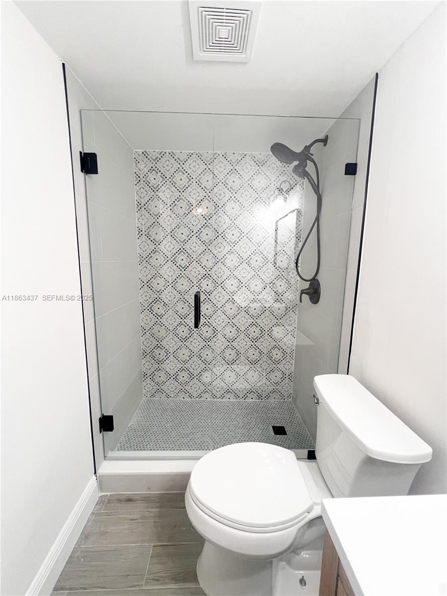 769 Jeffery Street, Unit 2205 Boca Raton, FL 33487 - Photo 8 of 30 a bathroom with a toilet and a shower