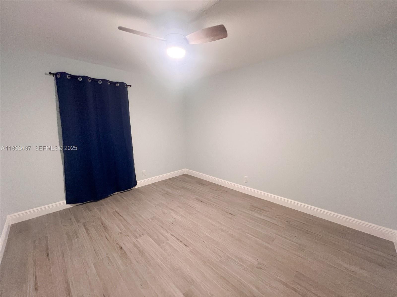 769 Jeffery Street, Unit 2205 Boca Raton, FL 33487 - Photo 9 of 30 a view of an empty room and wooden floor
