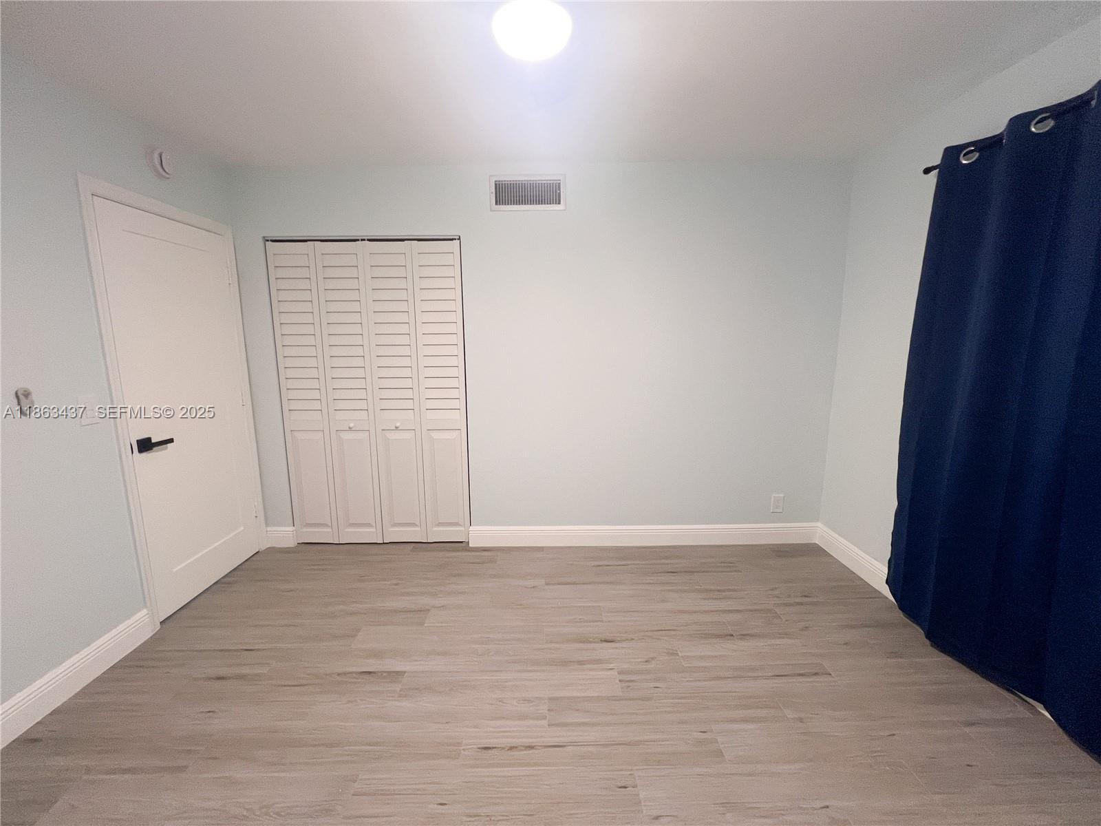 769 Jeffery Street, Unit 2205 Boca Raton, FL 33487 - Photo 10 of 30 wooden floor in an empty room
