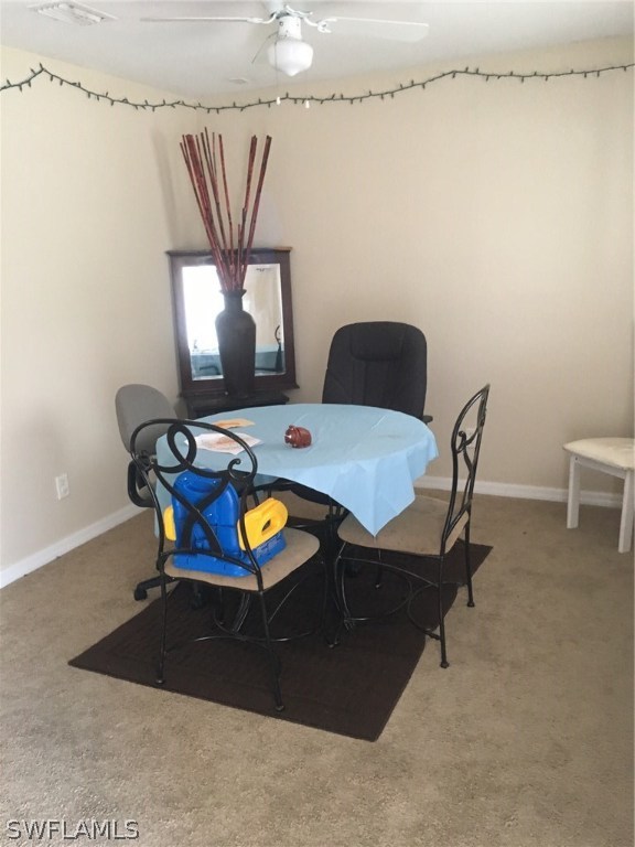 941 Homestead Road South, Unit 941/943 Lehigh Acres, FL 33974 - Photo 11 of 19 a living room with furniture and a chandelier