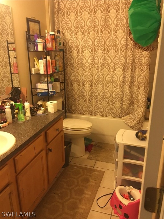 941 Homestead Road South, Unit 941/943 Lehigh Acres, FL 33974 - Photo 13 of 19 a bathroom with a sink mirror vanity and toilet