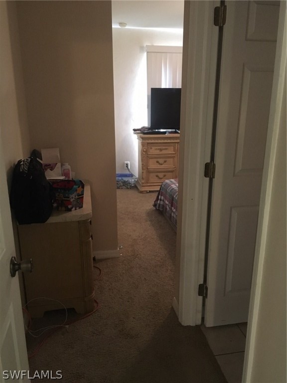 941 Homestead Road South, Unit 941/943 Lehigh Acres, FL 33974 - Photo 14 of 19 a room with furniture and a flat screen tv
