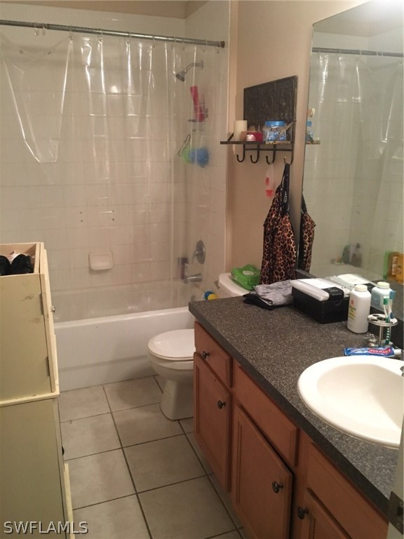 941 Homestead Road South, Unit 941/943 Lehigh Acres, FL 33974 - Photo 16 of 19 a bathroom with a granite countertop sink a toilet and shower