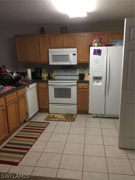 941 Homestead Road South, Unit 941/943 Lehigh Acres, FL 33974 - Photo 2 of 19 a kitchen with a cabinets and appliances