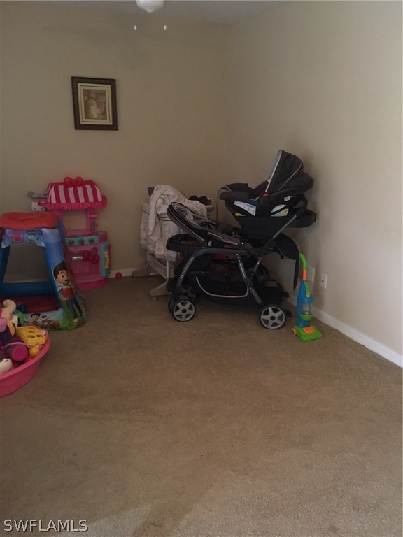 941 Homestead Road South, Unit 941/943 Lehigh Acres, FL 33974 - Photo 6 of 19 a bedroom with furniture and a fan