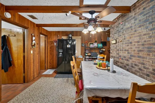 a dining room with furniture and chandelier