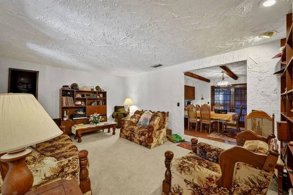 a bedroom with bed and a couch