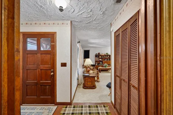 a bedroom with furniture and a closet