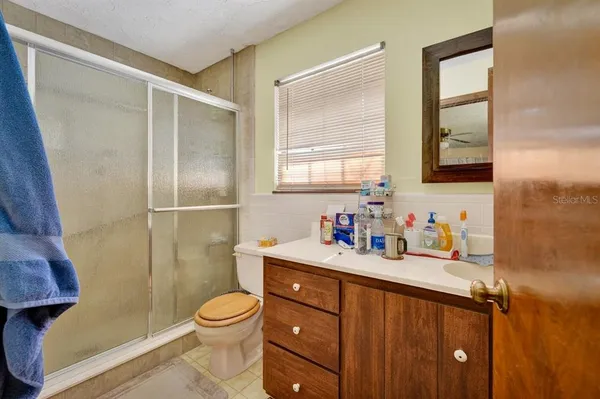 a bed room with two bed and a window