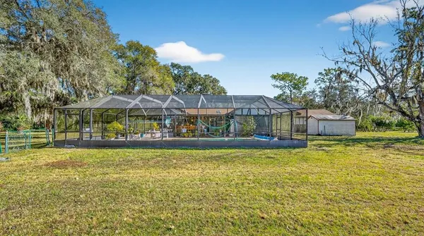 a view of a swimming pool with a patio