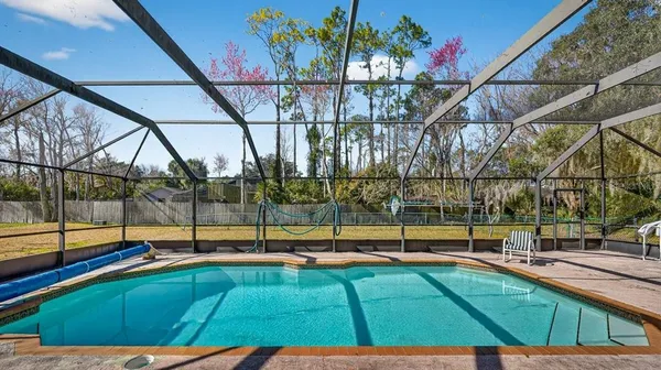 a view of a chairs and table in the patio