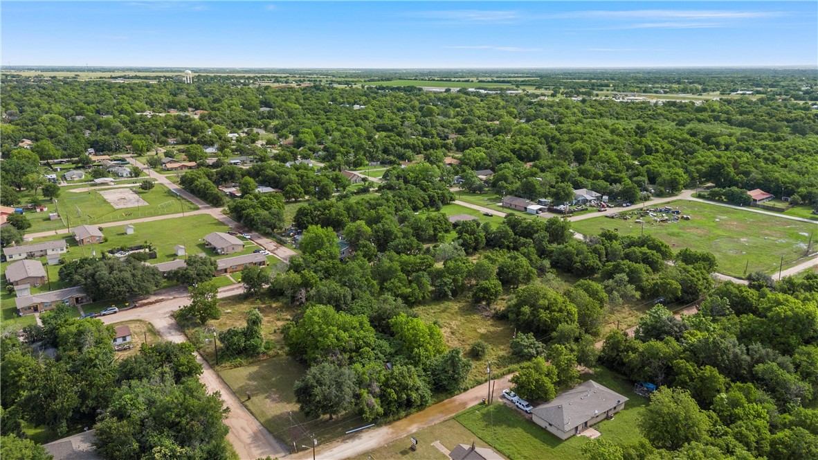 703 Stringfellow Avenue Marlin, TX 76661 - Photo 5 of 11 an aerial view of residential houses with outdoor space and trees