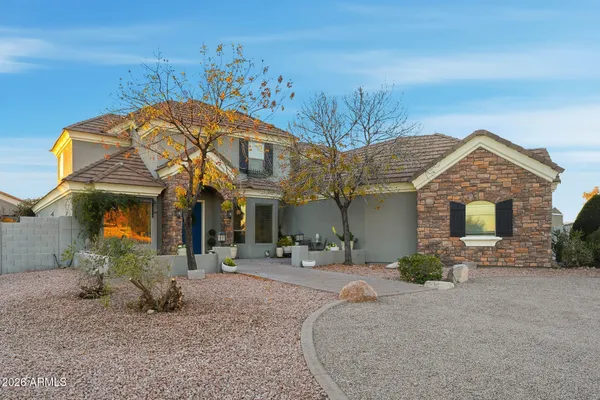 a kitchen with stainless steel appliances granite countertop a stove sink and cabinets