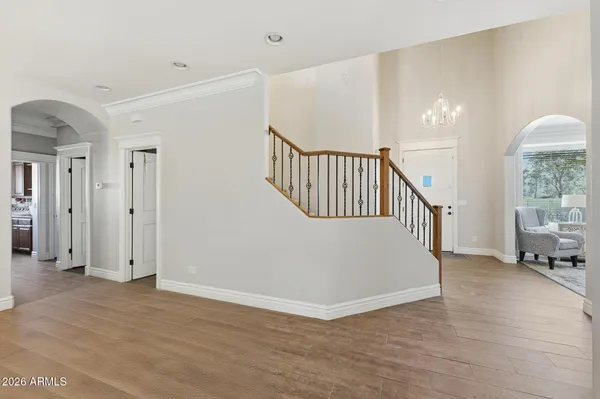 a bathroom with a granite countertop sink a large mirror and a shower