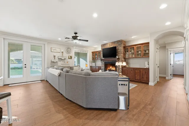 a spacious bathroom with a granite countertop sink a mirror and a shower