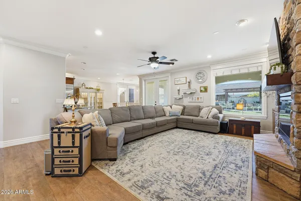 a living room with furniture and wooden floor