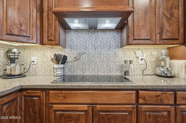 a bed room with a bed and a chandelier