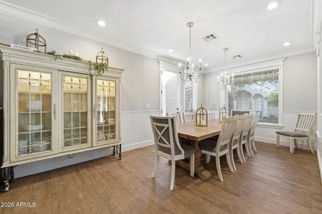 a kitchen with a stove and white cabinets