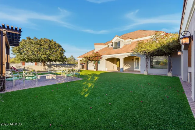 an aerial view of a house with a lake view