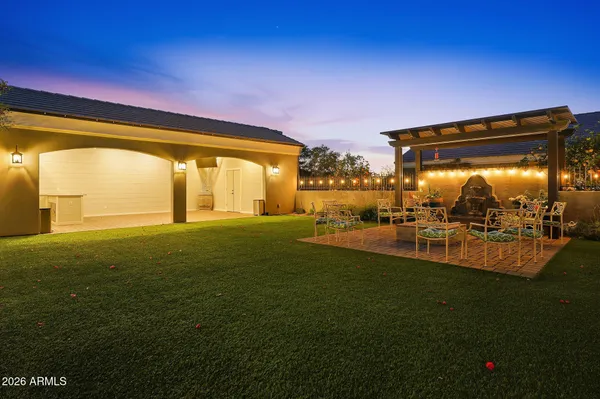 a view of a livingroom with wooden floor and stairs