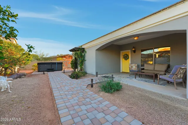 an aerial view of residential building with outdoor space and trees