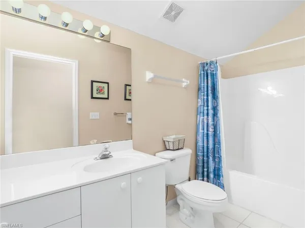 a bathroom with a sink toilet and vanity