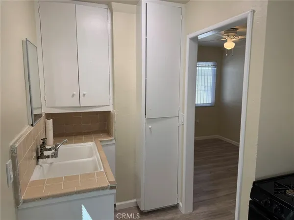 a room with a wooden floor and a window