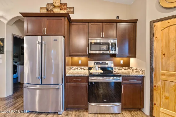 a bedroom with furniture and a rug