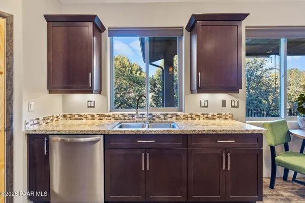 a view of balcony with wooden floor