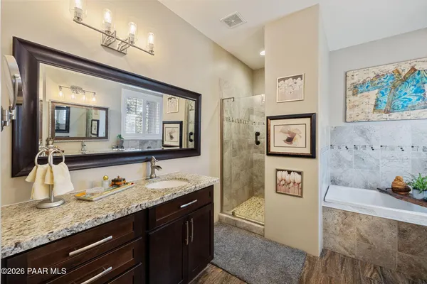 a view of a workspace with furniture and staircase